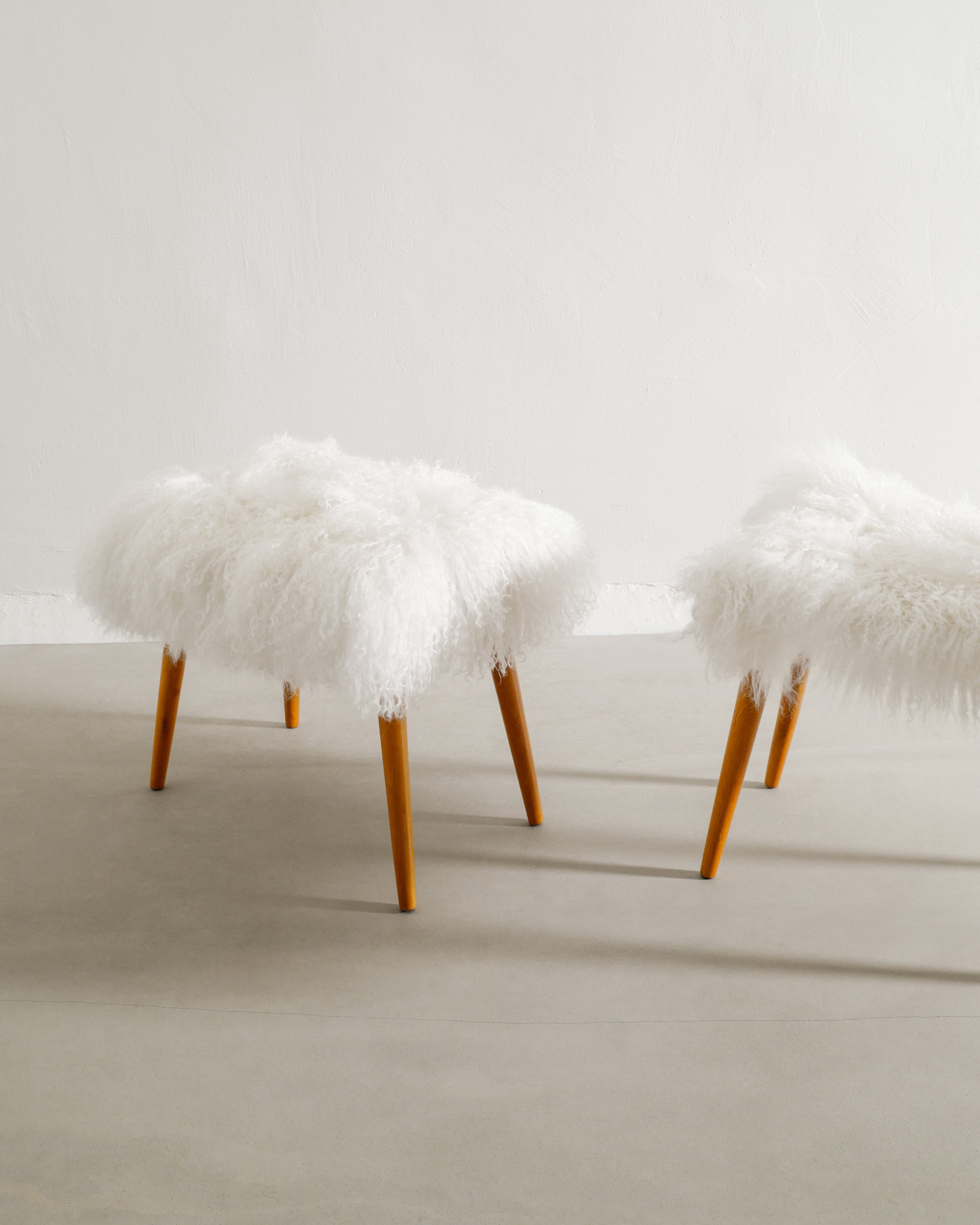 PAIR OF SWEDISH BEECH STOOLS WITH SHEEPSKIN